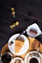coffee with dessert served at wooden tray at black wooden table. flat lay Royalty Free Stock Photo