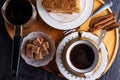 coffee with dessert served at wooden tray at black wooden table. food and wellness concept. flat lay Royalty Free Stock Photo