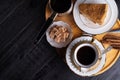 coffee with dessert served at wooden tray at black wooden table. food and wellness concept. flat lay Royalty Free Stock Photo