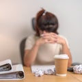 Coffee disposable cup against woman having Tired and Stressed while working, female businesswoman having headache and Migraine at