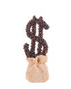Coffee dollar growing of burlap sack. Royalty Free Stock Photo