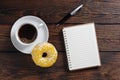 Coffee, donut and notebook