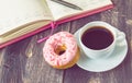 Coffee, donut and notepad on wooden background Royalty Free Stock Photo