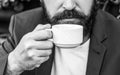 Coffee drink. Bearded man, hands holding a hot coffe cups. Coffe time. Black and white