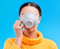 Coffee drinking, woman and studio with morning latte, mug and hot beverage. Isolated, blue background and female model Royalty Free Stock Photo