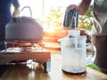 Coffee drip on camping. Pot stands on a portable gas stove. Royalty Free Stock Photo