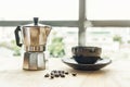 Coffee drip from steaming filter drip style on the table. Hot coffee in cups on a wooden tray. coffee beans on table. Smoke on the Royalty Free Stock Photo