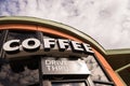 Coffee drive thru sign with cloudy sky Royalty Free Stock Photo