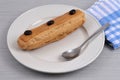 French coffee eclair served on a plate Royalty Free Stock Photo