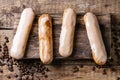 Coffee eclairs over wood Royalty Free Stock Photo