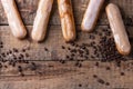 Coffee eclairs over wood Royalty Free Stock Photo