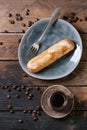 Coffee eclairs over wood Royalty Free Stock Photo