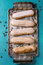 Coffee eclairs on vintage tray Royalty Free Stock Photo