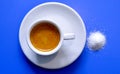 Coffee espresso cup  and sugar on blue background Royalty Free Stock Photo