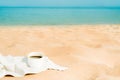 Coffee espresso cup with ocean , beach and seascape. Blue sky, white sand, woven zonik, wooden beach chair. Sea Royalty Free Stock Photo