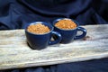 Coffee in espressocups  on a wooden board Royalty Free Stock Photo
