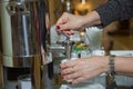 Coffee espresso shot on a hand . Hand with fresh Black Coffee Pouring from Coffee machine . Professional espresso Royalty Free Stock Photo