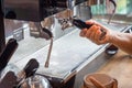 Coffee extraction from professional coffee machine. coffee machine preparing fresh coffee and pouring into cups at restaurant, bar Royalty Free Stock Photo