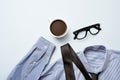 Coffee, eyeglasses, tie and shirt Royalty Free Stock Photo