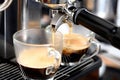 Coffee flowing into a cup from espresso machine Royalty Free Stock Photo