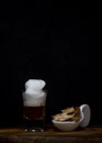 Coffee with foam in a small tube glass on a wood Royalty Free Stock Photo