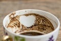 Closeup heart shape on Turkish coffee grounds in cup for fortune telling Royalty Free Stock Photo