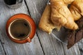 Coffee with french baget and croissants on provence style old wooden table. flat lay Royalty Free Stock Photo