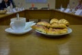 Coffee and fresh buns during the business meeting Royalty Free Stock Photo