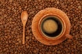 Coffee in full palm wood cup over coffee beans Royalty Free Stock Photo