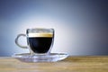 Coffee in the glass cup. Cup of coffee against blurred background. Coffee cup. Royalty Free Stock Photo