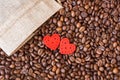 Coffee grains and red hearts on a wooden table. Coffee is a favorite drink. Panorama_ Royalty Free Stock Photo