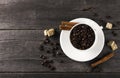 Coffee grains, sugar, cinnamon on dark wooden background Royalty Free Stock Photo