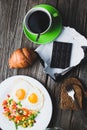 Coffee in a green mug on wooden surface Royalty Free Stock Photo