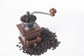 Coffee grinder with arabica coffee beans on white Royalty Free Stock Photo