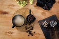 Coffee grinder, Coffee bean, Coffee and sweets. Coffee cup and sweets on wooden table Royalty Free Stock Photo