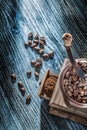 Coffee grinder beans on vintage wooden board Royalty Free Stock Photo