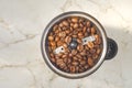 Coffee grinder with coffee beans Royalty Free Stock Photo