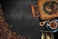 Coffee Grinder and Cup with Roasted Coffee Beans on a Blackboard Royalty Free Stock Photo