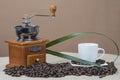Coffee grinder and cups on some bean