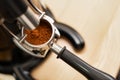 coffee grinder grinding coffee pouring into a portafilter Royalty Free Stock Photo