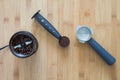 Coffee grounds in a scoop with coffee grinder Royalty Free Stock Photo