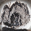 Coffee grounds and stains on steel Royalty Free Stock Photo