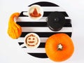 Coffee with Halloween topping, pumpkins and French press on a background of black and white stripes Royalty Free Stock Photo