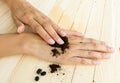 Coffee hand scrub with ground coffee and coffee beans Royalty Free Stock Photo