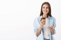 Coffee helps creativity florish. Portrait of charming smart and stylish good-looking female employee holding paper cup