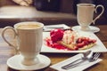 Coffee hot drink and ice cream strawberry crepe on wood table in Royalty Free Stock Photo