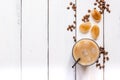 Coffee ice cubes and beans with latte on white desk background top view Royalty Free Stock Photo