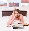 Coffee inspiring him to write. Man writer lay bed bedclothes working book. Writer romantic author used old fashioned