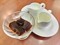 Coffee jelly, jelly dessert flavored made from black coffee and gelatin, serving with milk and syrup. Refreshing dessert for