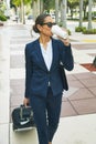 Coffee keeps her going. a young businesswoman drinking coffee on the move in the city. Royalty Free Stock Photo
